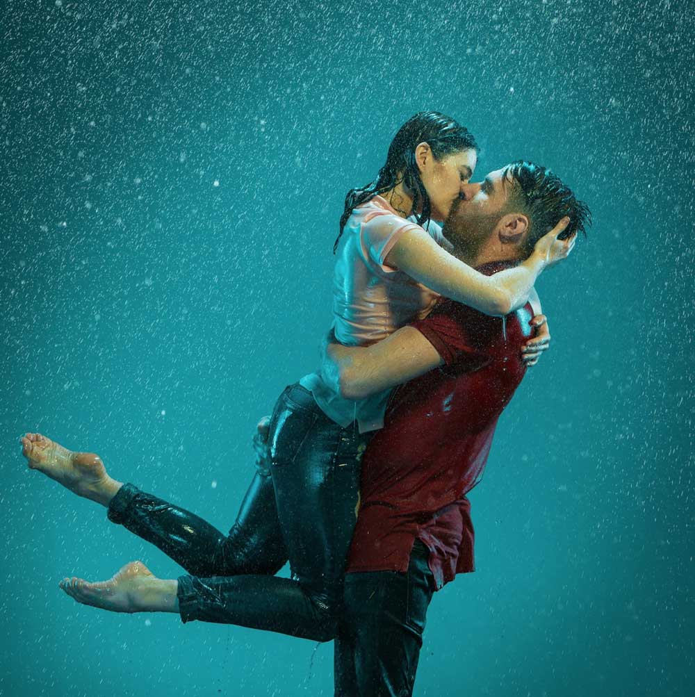 Image by master1305 on Freepik Dance couple kissing in the rain
